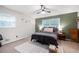 Comfortable bedroom with large windows, ceiling fan and carpeted floors at 695 Hiram Sudie Rd, Dallas, GA 30157
