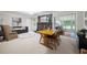 Cozy dining area with a fireplace, comfortable seating, and views of the sunroom at 695 Hiram Sudie Rd, Dallas, GA 30157