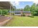 Exterior view of the brick home with attached covered area in the backyard providing lots of space at 695 Hiram Sudie Rd, Dallas, GA 30157