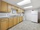 Basement kitchen features ample cabinet space, essential appliances, and functional layout at 695 Hiram Sudie Rd, Dallas, GA 30157