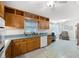 Traditional kitchen featuring wood cabinets, tile floors and stainless steel appliances at 695 Hiram Sudie Rd, Dallas, GA 30157
