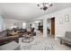 Spacious living area with a comfortable couch, modern rug, and seamless flow to other rooms at 695 Hiram Sudie Rd, Dallas, GA 30157