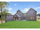 Expansive backyard featuring a covered outdoor living space perfect for entertaining at 115 Nova Lane, Roswell, GA 30075