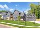 Beautifully landscaped property featuring a charming modern home with a three-car garage at 115 Nova Lane, Roswell, GA 30075
