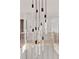 Grand foyer featuring a modern chandelier and staircase at 115 Nova Lane, Roswell, GA 30075