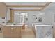 Open concept kitchen with modern appliances, large marble island and wooden beams at 115 Nova Lane, Roswell, GA 30075