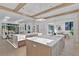 Bright, open kitchen featuring 2 large islands, a breakfast nook and access to the living room at 115 Nova Lane, Roswell, GA 30075