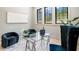 Bright and airy home office featuring a glass desk and comfortable seating at 115 Nova Lane, Roswell, GA 30075