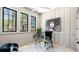Bright home office with modern decor, including black trim windows and stylish furnishings at 115 Nova Lane, Roswell, GA 30075