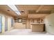 Finished basement featuring recessed lighting, a bar area, and access to the outside at 1415 Liberty Ln, Cumming, GA 30040