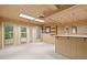 Finished basement featuring recessed lighting, a bar area, and access to the outside at 1415 Liberty Ln, Cumming, GA 30040