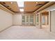 Finished basement area leads to the patio with glass doors and windows at 1415 Liberty Ln, Cumming, GA 30040