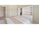Bedroom featuring a dresser with shelves and two closets with an ensuite bath at 1415 Liberty Ln, Cumming, GA 30040
