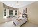 Cozy bedroom with a window seat and large bay windows that let in plenty of natural light at 1415 Liberty Ln, Cumming, GA 30040