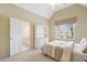 Comfortable bedroom featuring a vaulted ceiling, dresser, and connecting bathroom at 1415 Liberty Ln, Cumming, GA 30040