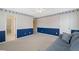 Large bedroom with blue accents, plush carpet, and connecting doors to other rooms at 1415 Liberty Ln, Cumming, GA 30040