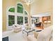 Bright living room featuring high ceilings, large windows, and seamless access to kitchen and dining area at 1415 Liberty Ln, Cumming, GA 30040