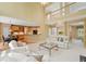 Bright living room boasts soaring ceilings, open floor plan, and seamless flow to a modern kitchen at 1415 Liberty Ln, Cumming, GA 30040