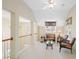 Upstairs loft space featuring neutral carpet, decorative chandelier, and ample natural light at 1415 Liberty Ln, Cumming, GA 30040