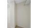 A walk-in closet features carpet and plenty of space for storage at 1415 Liberty Ln, Cumming, GA 30040