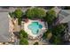 Aerial view of a clover-shaped community pool, surrounded by lush landscaping and residential buildings at 1735 Peachtree Ne St # 117, Atlanta, GA 30309