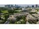 Aerial view of a residential complex featuring mature trees and convenient access to the city skyline at 1735 Peachtree Ne St # 117, Atlanta, GA 30309