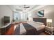 This bedroom features a tray ceiling with a ceiling fan and includes a large window at 1735 Peachtree Ne St # 117, Atlanta, GA 30309