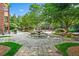 Picturesque community fountain surrounded by manicured gardens, benches, and walking paths at 1735 Peachtree Ne St # 117, Atlanta, GA 30309