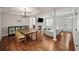 Open floor plan with a fireplace, dining area, and hardwood floors throughout at 1735 Peachtree Ne St # 117, Atlanta, GA 30309