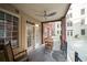 Outdoor patio featuring a brick railing, ceiling fan, and a table with four chairs at 1735 Peachtree Ne St # 117, Atlanta, GA 30309