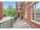 Exterior view of patio featuring ceiling fan and outdoor seating with views of landscaping at 1735 Peachtree Ne St # 117, Atlanta, GA 30309