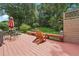 Charming back deck with outdoor seating area, great for entertaining or enjoying the peaceful backyard at 2011 Sturbridge Ln, Buford, GA 30519