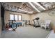 Spacious unfinished basement featuring workout equipment and a classic rocking chair at 2011 Sturbridge Ln, Buford, GA 30519