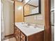 Bathroom features a wood vanity with white countertop and soft neutral colored walls at 2011 Sturbridge Ln, Buford, GA 30519