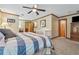 Bedroom featuring a ceiling fan, warm neutral colors, and comfortable finishes at 2011 Sturbridge Ln, Buford, GA 30519