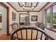 Warm dining room features hardwood floors, a chandelier, and large windows at 2011 Sturbridge Ln, Buford, GA 30519