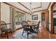 Charming dining room with hardwood floors, chandelier lighting, and a large window at 2011 Sturbridge Ln, Buford, GA 30519