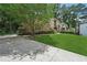 Beautiful home featuring a well-manicured lawn, mature trees, and a concrete driveway at 2011 Sturbridge Ln, Buford, GA 30519
