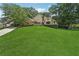 Lovely home with a sprawling green lawn, mature trees, and a well-maintained exterior at 2011 Sturbridge Ln, Buford, GA 30519