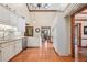 Bright kitchen features white cabinets, granite countertops, and stainless steel appliances at 2011 Sturbridge Ln, Buford, GA 30519