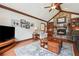 Living room featuring stone fireplace, vaulted ceiling, and hardwood floors at 2011 Sturbridge Ln, Buford, GA 30519