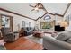 Spacious living room with vaulted ceiling, hardwood floors, and abundant natural light at 2011 Sturbridge Ln, Buford, GA 30519