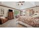 Spacious main bedroom featuring a tray ceiling, plush carpeting, and a sitting area at 2011 Sturbridge Ln, Buford, GA 30519