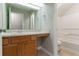 Bathroom featuring vanity with wooden drawers and cabinets, a mirror, and toilet with a bathtub at 2191 Phillips Rd, Lithonia, GA 30058