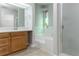 Bathroom featuring stained glass and a shower and bathtub combo at 2191 Phillips Rd, Lithonia, GA 30058
