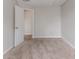 Bedroom with neutral paint and carpet with a view into another room through an open white door at 2191 Phillips Rd, Lithonia, GA 30058