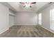 Bedroom featuring neutral paint and carpet and tray ceiling with ceiling fan at 2191 Phillips Rd, Lithonia, GA 30058