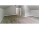 Bonus room with neutral paint and carpet with a view into another room through an open white door at 2191 Phillips Rd, Lithonia, GA 30058