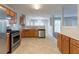 Traditional kitchen with stainless steel appliances and oak cabinets, offering a functional cooking space at 2191 Phillips Rd, Lithonia, GA 30058