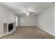 Spacious living room with a fireplace and ample natural light from large windows at 2191 Phillips Rd, Lithonia, GA 30058